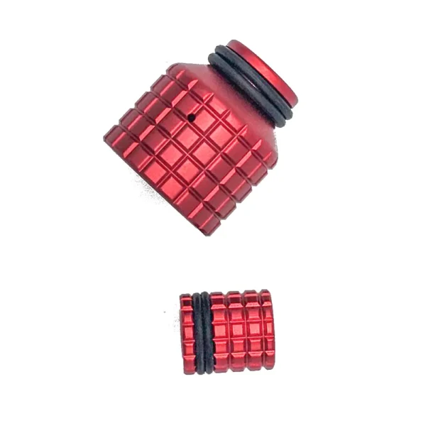 Red metal nozzle and adapter with grooves.