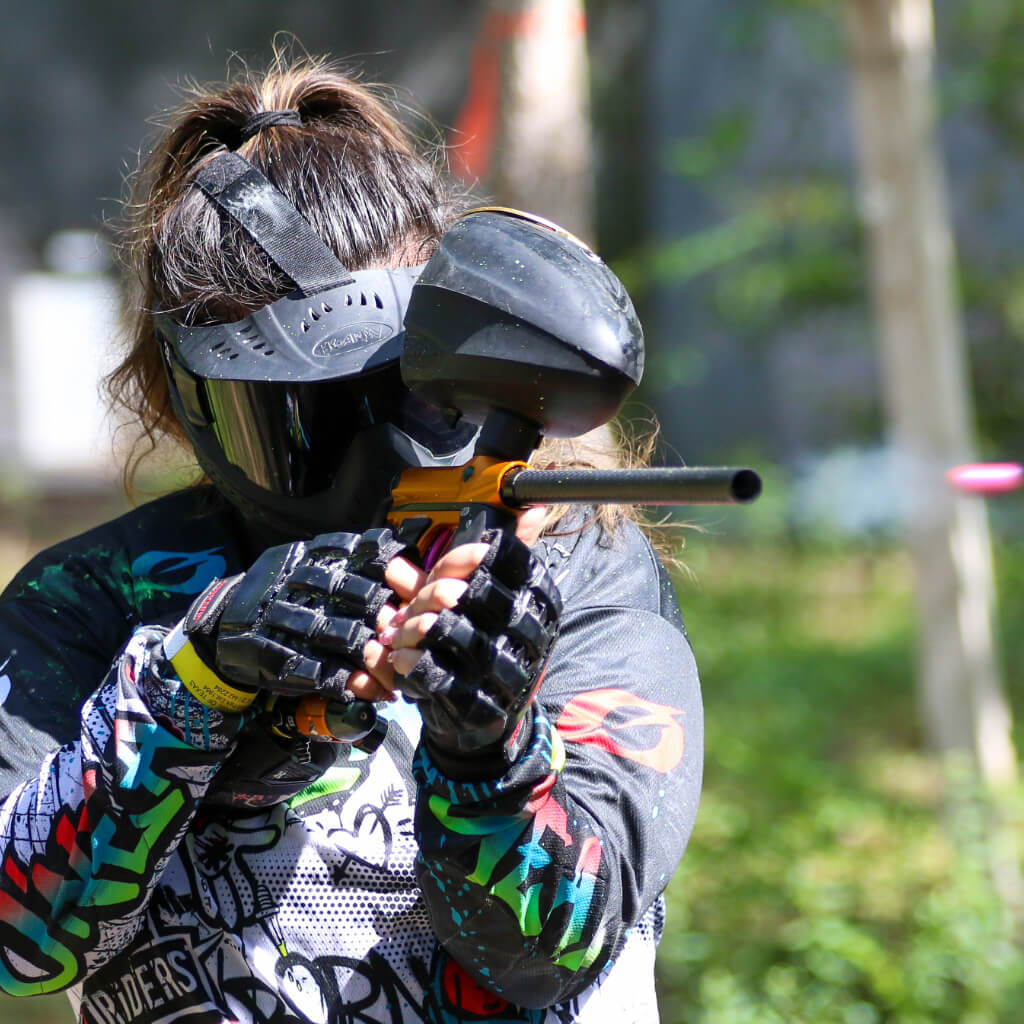 Paintball player shooting