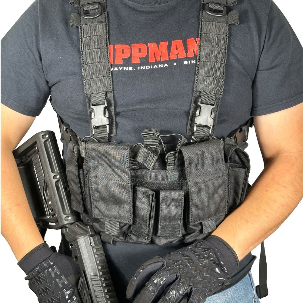 Person wearing a black tactical vest.