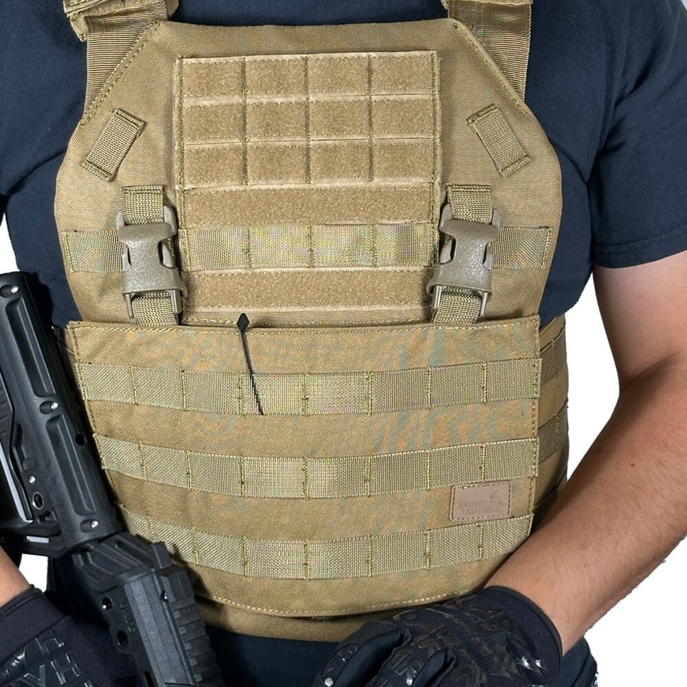 Person wearing tactical vest and gloves.